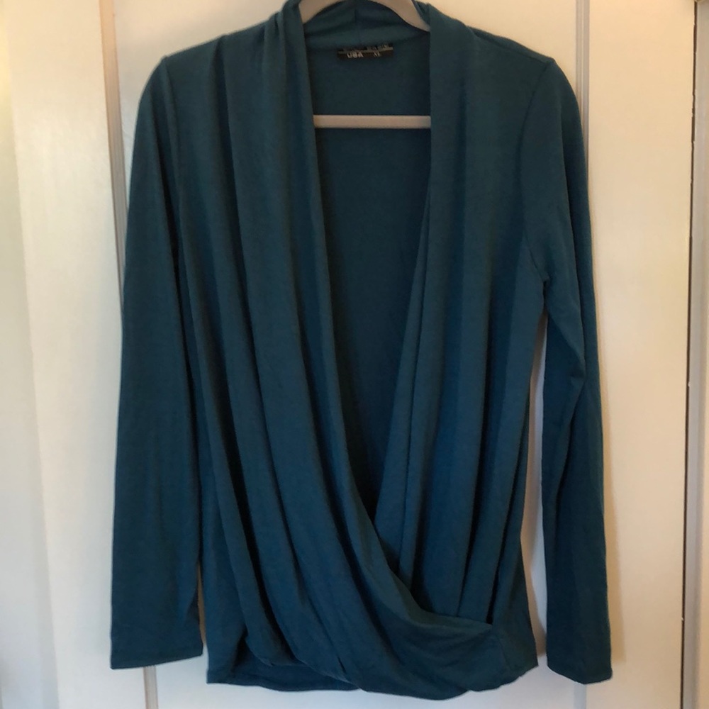 Shop Basic jewel toned turquoise cross front top.